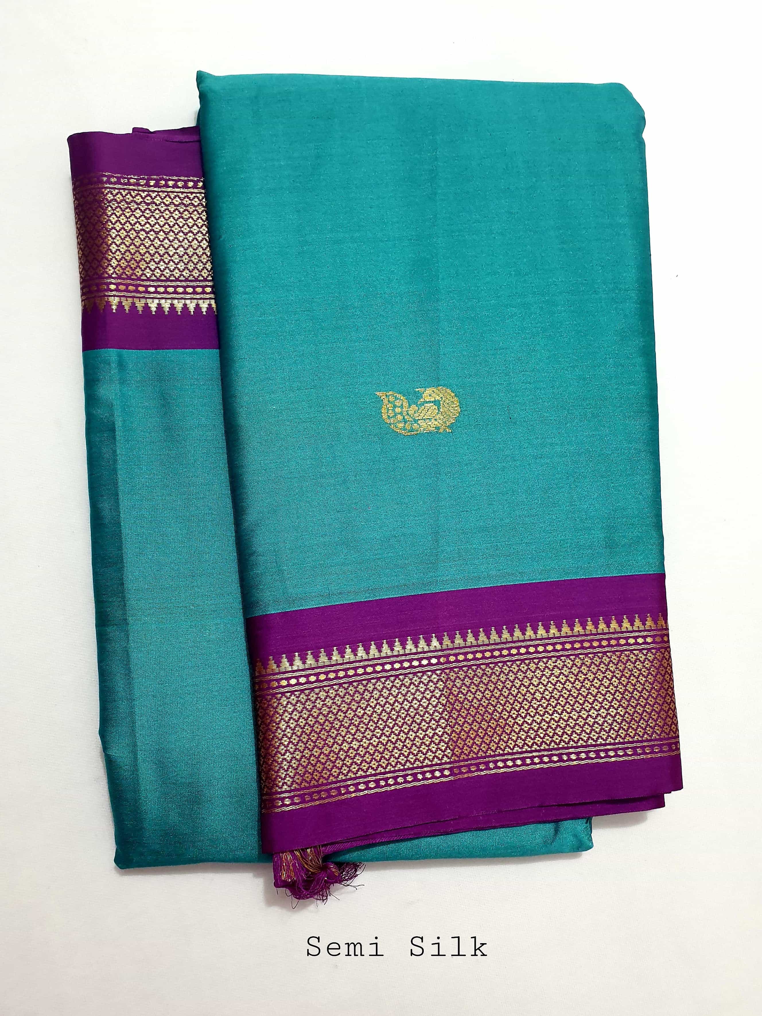 Pink semi-paithani saree with peacock buttas, contrast muniya border &  pallu with multi-color floral vine & peacocks