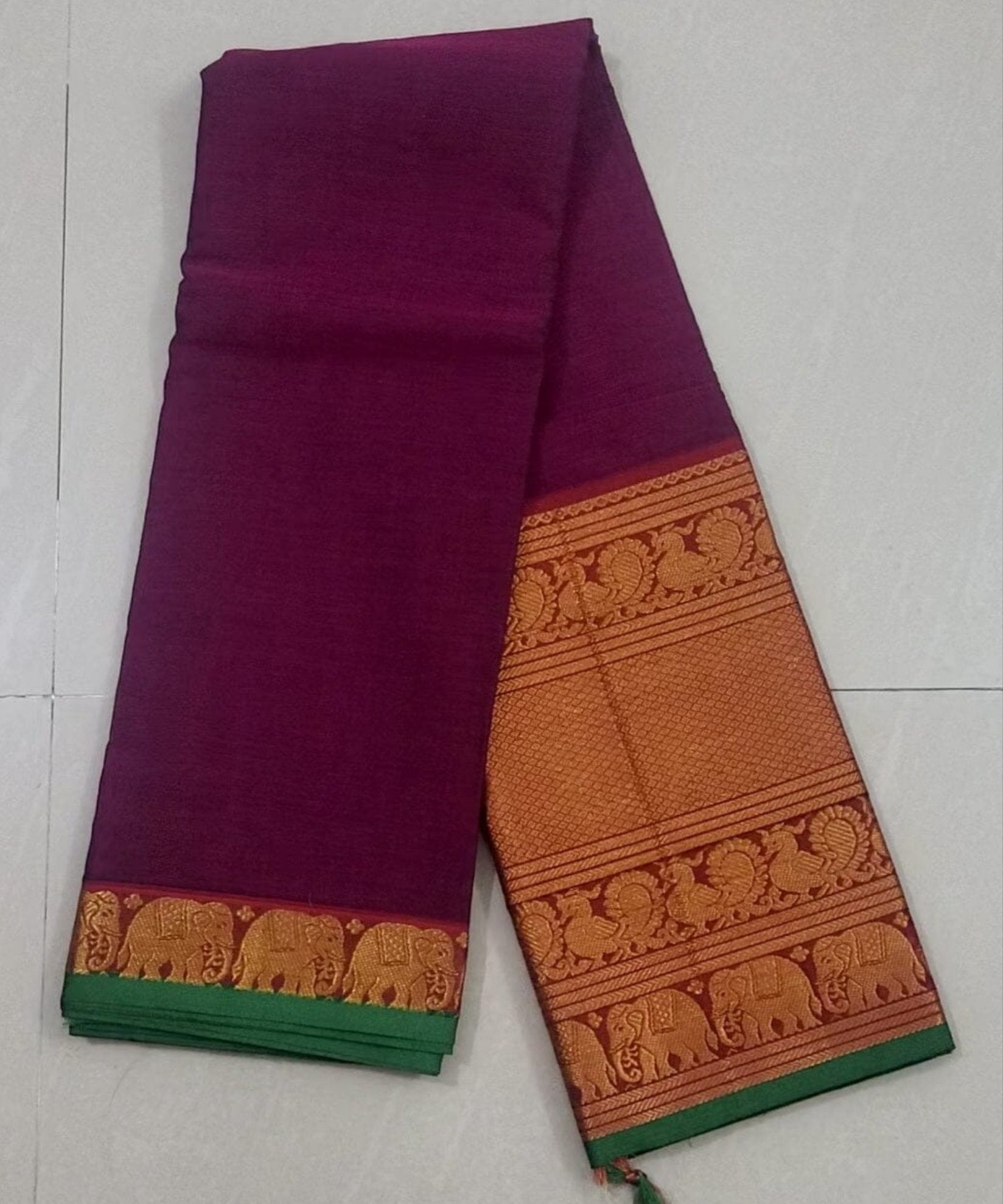 Dazzling Red Kancheepuram silk saree with zari buttas, contrast getti border  & pallu features intricate manga design